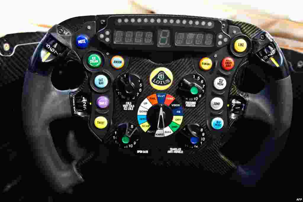 This handout picture received from the Lotus Formula One Team shows the tongue-in-cheek design of the steering wheel on the team&#39;s newly launched E21 car. Lotus has set its sights on a top-three finish in this year&#39;s Formula One world championship after becoming the first team to unveil their car for the forthcoming campaign. (AFP)