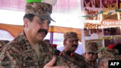 Pakistani army chief Raheel Sharif addresses internally displaced Pakistani civilians fleeing a 2014 military operation against Taliban militants in the North Waziristan tribal agency.