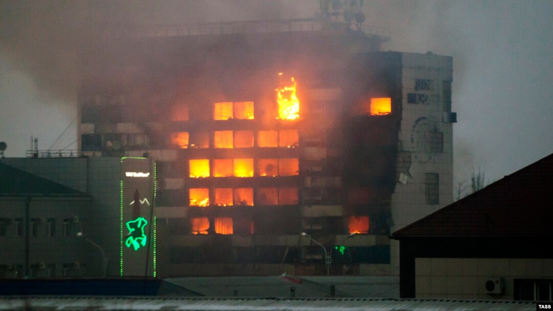 A local media building called the Press House is set ablaze following a gun battle with Chechen insurgents in the regional capital, Grozny, on December 4.