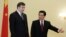 Chinese President Hu Jintao (right) greets President Saakashvili in Beijing today
