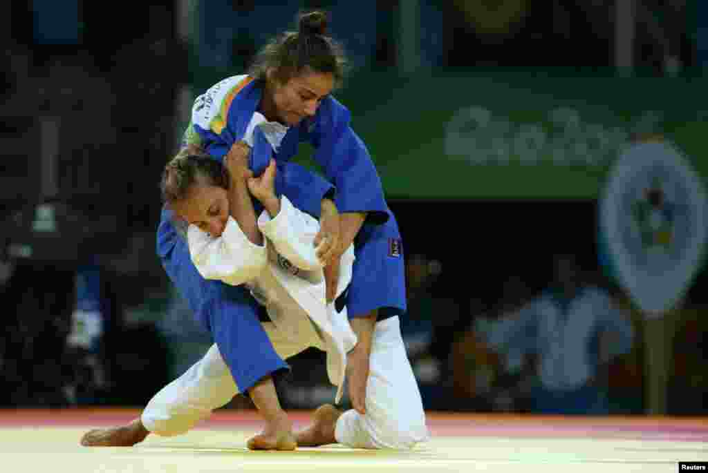 Majlinda Kelmendi (top) of Kosovo and Odette Giuffrida of Italy compete in the women&rsquo;s 52-kilogram judo final. Kelmendi made history by winning Kosovo&rsquo;s first Olympic gold medal.