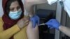 Migrants In Serbia Receive First Dose Of AstraZeneca Vaccine