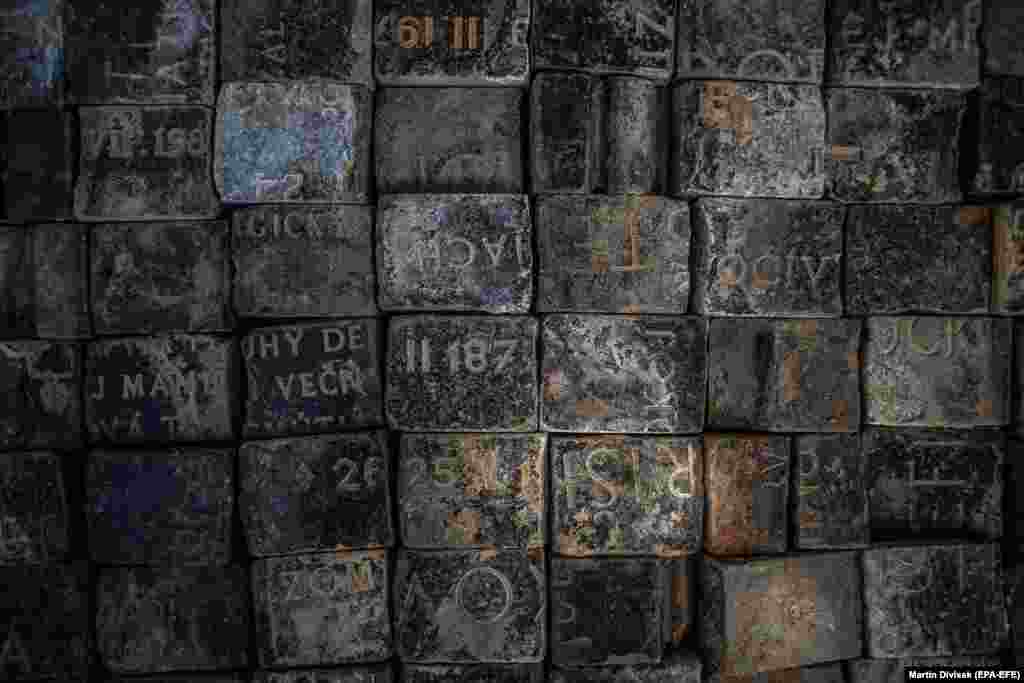 Cobblestones with Jewish tombstone fragments on display at a construction site in Wenceslas Square in Prague. Hundreds of cobblestones created from cut Jewish tombstones were found in recent days during the reconstruction of the square. According to the Jewish community in Prague, during the manual dismantling of the original paving, dozens of stones with remnants of texts and hundreds of stones made of polished marble were found. These findings confirm that during the communist regime, Jewish gravestones often served as building material. (epa-EFE/Martin Divisek)