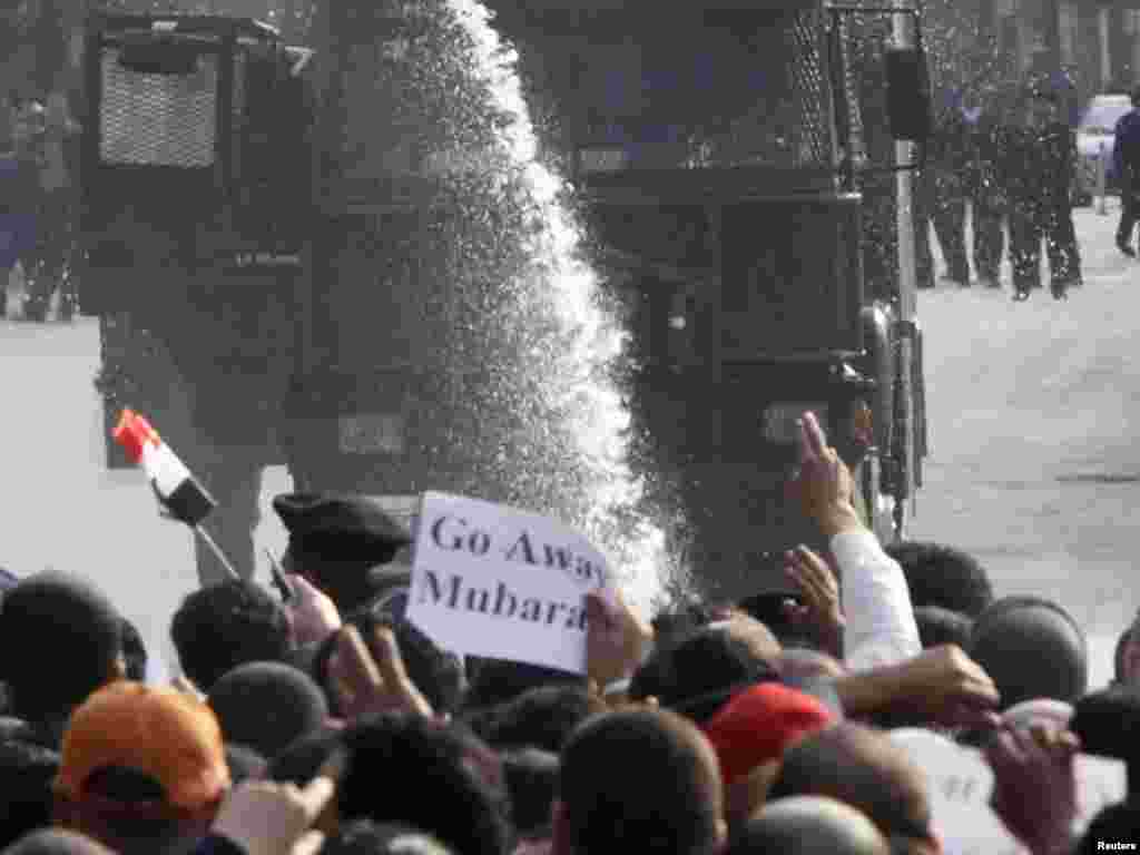 Police use a water cannon against antigovernment protesters in downtown Cairo on January 25, 2011.