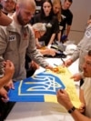 Heavyweight boxing world champion Oleksandr Usyk meets Ukrainian war veterans in London on July 17.<br><br>Usyk will face British boxer Daniel Dubois in a heavyweight rematch on July 19 that will net the Ukrainian a reported $132.8M, one of the largest payouts in boxing history. Usyk’s dominance as a heavyweight against much larger opponents has become a powerful symbol for Ukrainians amid the ongoing Russian invasion.