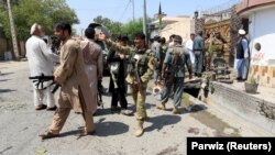 AFGHANISTAN -- Afghan security force stand at the site of a suicide attack in Jalalabad city, August 30, 2017