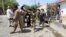 AFGHANISTAN -- Afghan security force stand at the site of a suicide attack in Jalalabad city, August 30, 2017