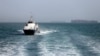 In this picture obtained from Iran's semiofficial ISNA news agency the Iranian-flagged passenger vessel Atlas Pishro cruises near ships anchored in the Strait of Hormuz on May 2. 