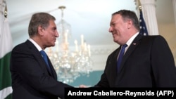 FILE: U.S. Secretary of State Mike Pompeo (R) meets with Pakistani Foreign Minister Shah Mehmood Qureshi at the US State Department in Washington on October 2.