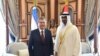 Uzbek President Shavkat Mirziyoev (left) attends a welcoming ceremony in Abu Dhabi on March 25.