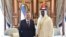 Uzbek President Shavkat Mirziyoev (left) attends a welcoming ceremony in Abu Dhabi on March 25.