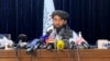 Taliban spokesman Zabihullah Mujahid speaks at at his first news conference in Kabul on August 17. 