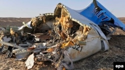 Debris from the Russian airliner that crashed on Egypt's Sinai Peninsula lies strewn across a wide area.