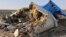 Debris from the Russian airliner that crashed on Egypt's Sinai Peninsula lies strewn across a wide area.