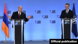 Belgium -- NATO Secretary General Jens Stoltenberg (R) and Armenian President Armen Sarkissian hold a news conference after talks in Brussels, October 21, 2020.