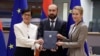 Belgium - The EU's foreing policy chief Kaja Kallas (right), enlargement commissioner Marta Kos and Armenian Foreign Minister Ararat Mirzoyan sign an agreement in Brussels, December 2, 2025.