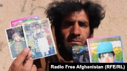 Naqibullah holds up photographs of himself from before he was blinded in 2013 by a landmine explosion.