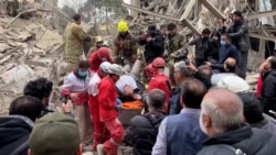 Iranian Emergency Workers Search For Survivors Trapped Under Rubble