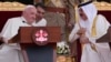 Pope Francis (left) talks with Bahrain's King Hamad bin Isa Al Khalifa on November 4.