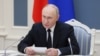 Vladimir Putin conducts an exercise of Russia's strategic nuclear deterrence forces