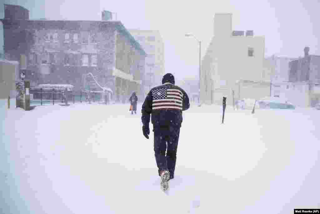 A man pushes his way through a winter snowstorm in Atlantic City, New Jersey. (AP/Matt Rourke)