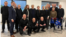 A photo containing several of the 250 prisoners released by Belarus on March 19 as part of a deal negotiated with US Special Envoy John Coale (center, back row).