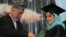 Afghan President Hamid Karzai shakes hands with a female student during a university graduation ceremony in Kabul.