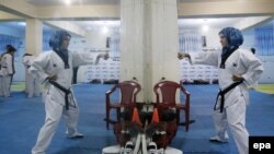 Afghan girls practice tae kwan do at a gym in Kabul.