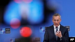 NATO Secretary-General Jens Stoltenberg speaks to reporters after an extraordinary meeting of NATO foreign ministers in Brussels on January 7.