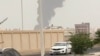 A plume of smoke rises at a refinery in Jizan as Yemen's Iran-backed Houthis said on July 25 that they carried out strikes on targets in Saudi Arabia. 