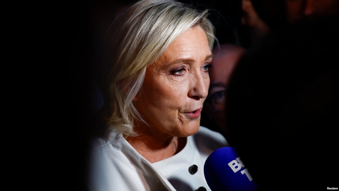 French far-right leader Marine Le Pen talks to journalists on July 7.