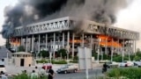 A building of Iranian state broadcaster IRIB in flames after an Israeli air attack in Tehran
