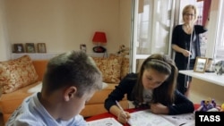  Boy and girl do grammar exercises during a private lesson
