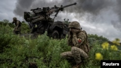 Ukrainian soldiers fire a Caesar self-propelled howitzer toward Russian troops near Avdiyivka on May 31.