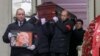 Pallbearers carry the late activist Lyudmila Alekseyeva's coffin after a mourning ceremony in Moscow on December 11. 