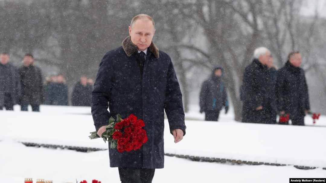 Russian President Vladimir Putin lays flowers during a ceremony to mark the 75th anniversary of the Soviet breakthrough in the Nazi Siege of Leningrad in World War II, in St. Petersburg on January 18. 
