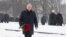 Russian President Vladimir Putin lays flowers during a ceremony to mark the 75th anniversary of the Soviet breakthrough in the Nazi Siege of Leningrad in World War II, in St. Petersburg on January 18. 