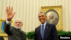Barack Obama (sağda) və Narendra Modi (arxiv fotosu)