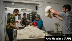 Nagorno Karabakh -- People make bread at a bakery in Stepanakert, that works 24 hours a day to offer free bread to remaining residents and delivering - when needed - to the towns of Martuni and Martakert, October 21, 2020, 