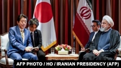 President Hassan Rouhani meeting with Japanese Prime Minister Shinzo Abe on the sidelines of the 74th United Nations General Assembly in New York. (Photo by - / Iranian Presidency / AFP). President Rouhani is to visit Japan later this week. 