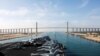 The Nimitz-class aircraft carrier USS Abraham Lincoln approaches the Mubarak Peace Bridge as it transits the Suez Canal in Egypt, May 9, 2019.