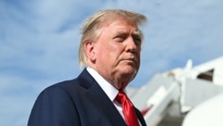 US President Donald Trump speaks to reporters before boarding Air Force One at Joint Base Andrews, Maryland, on August 21.