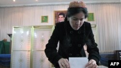 A woman casts her ballot at a polling station in Ashgabat.