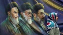 تصاویر رهبران جمهوری اسلامی در یک قاب روی دیوار ساختمانی در تهران
