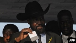 Southern Sudan leader Salva Kiir casts his vote at a polling station in Juba.