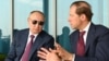 Russian President Vladimir Putin (left) listens to Industry and Trade Minister Denis Manturov. An extraordinary session of the Russian State Duma will consider the nomination of Manturov to the position of deputy prime minister.