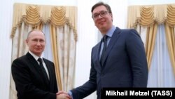 Russian President Vladimir Putin (left) meets with Serbian Prime Minister Aleksandar Vucic in Moscow on March 27. 