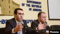 Armenia - Deputy Minister of Economy Garegin Melkonian (L) speaks at a press conference in Yerevan, 18Feb2014.