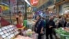 People shop for groceries at the historic Tajrish bazaar in northern Tehran on August 25.