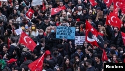 People take part in a protest in Istanbul on March 23, the day Istanbul Mayor Ekrem Imamoglu was controversially jailed as part of a corruption investigation.